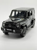 Front three-quarter view of black 1:32 scale Mercedes-Benz G63 AMG diecast model.
