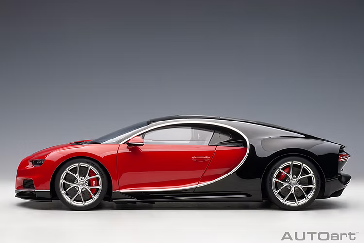 Side profile view of red Bugatti Chiron Sport diecast model