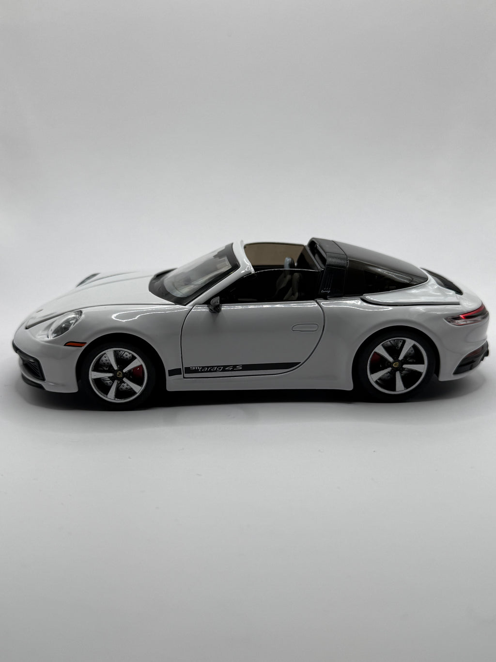 Side profile of Porsche Targa model showing alloy wheels and rubber tyres