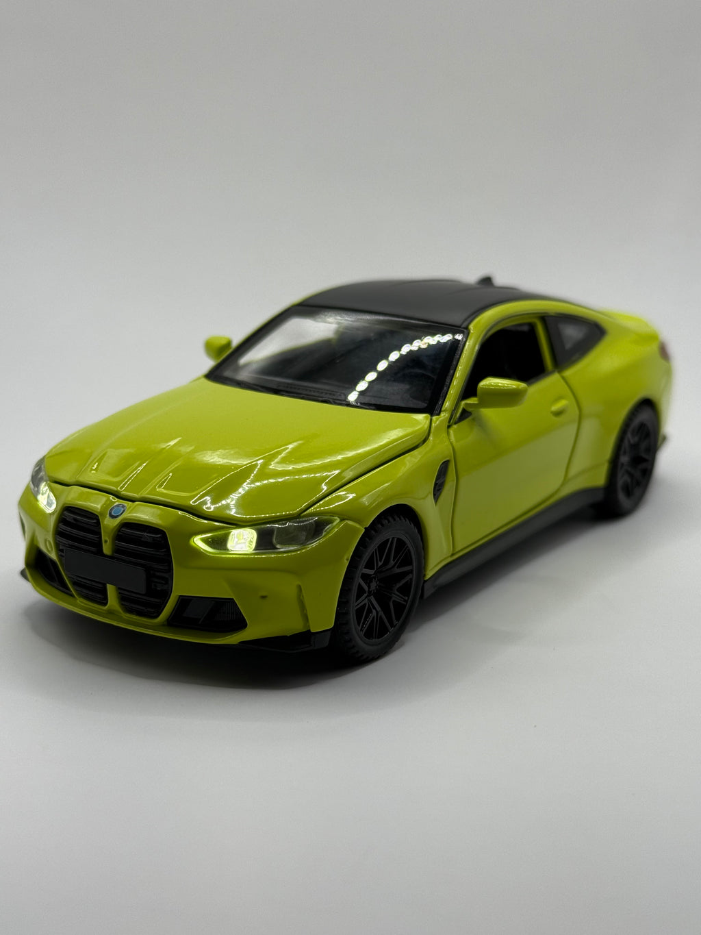 1:32 scale BMW M4 diecast model car in Lime Green with alloy metal body and realistic rubber tires, side profile view.