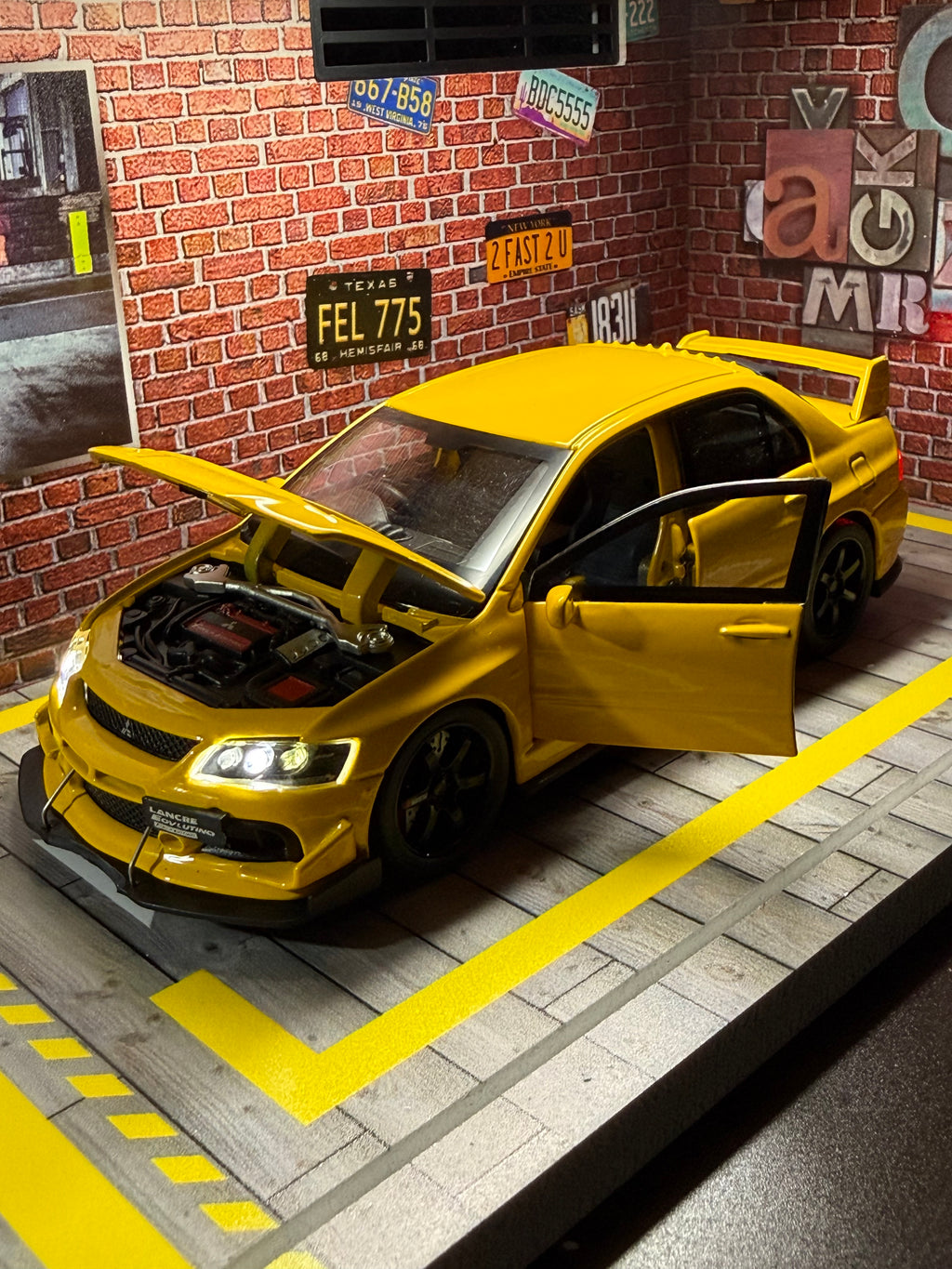 JDM Mitsubishi Evo IX toy car with opening doors and hood
