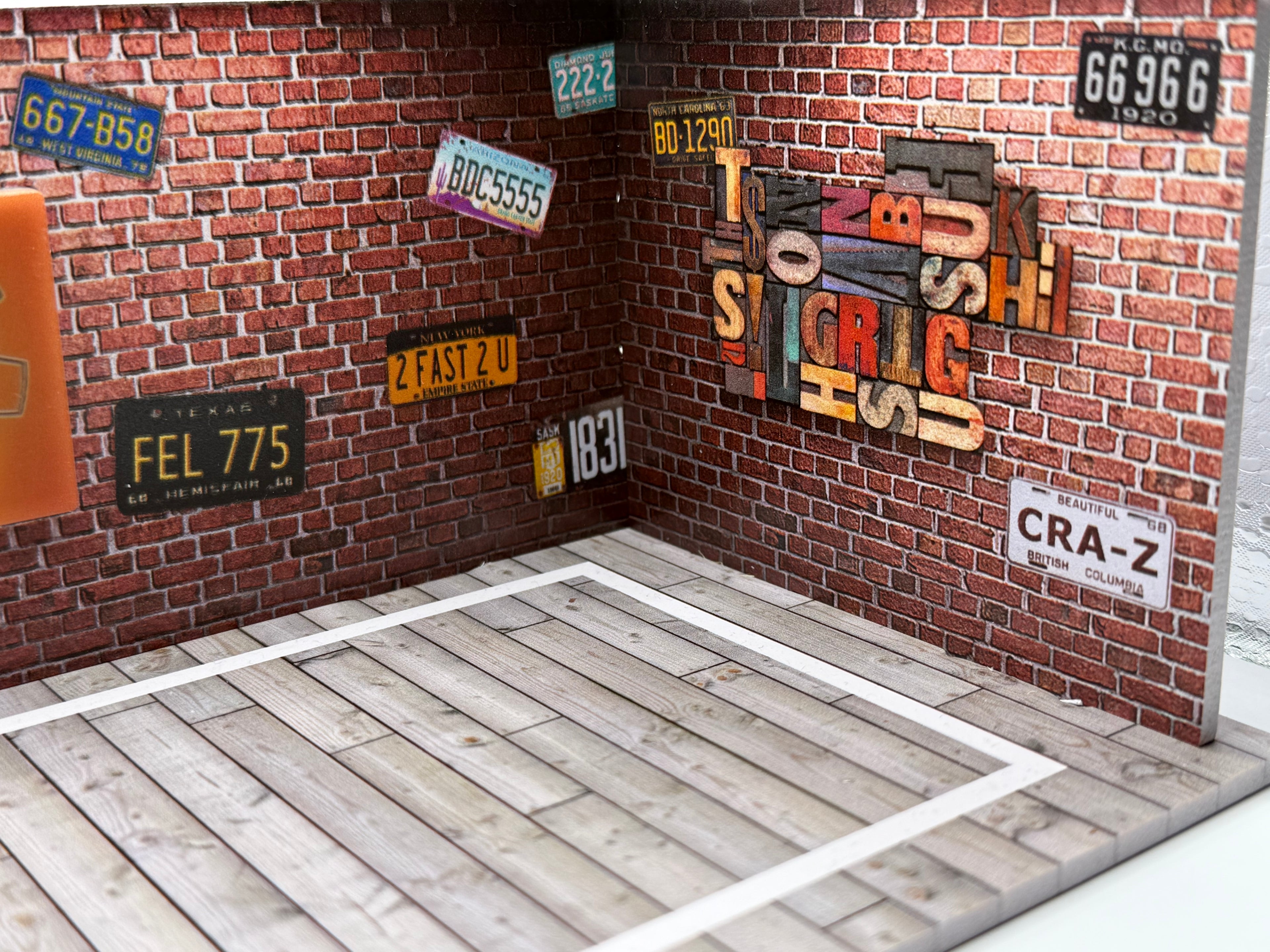 Close up of realistic concrete texture on miniature parking lot diorama.