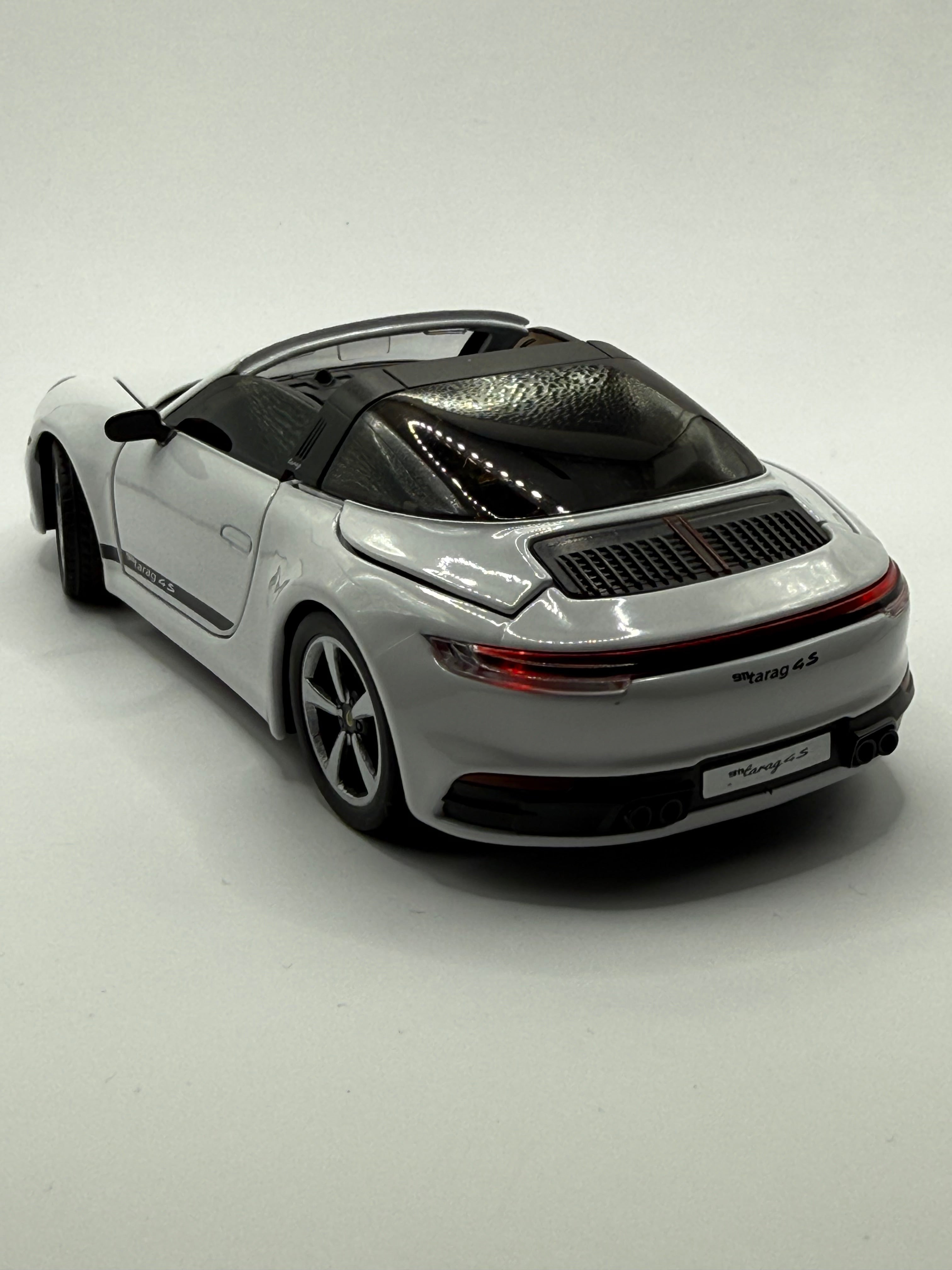 Rear of Porsche 911 model showing quad exhausts and Targa roll bar.