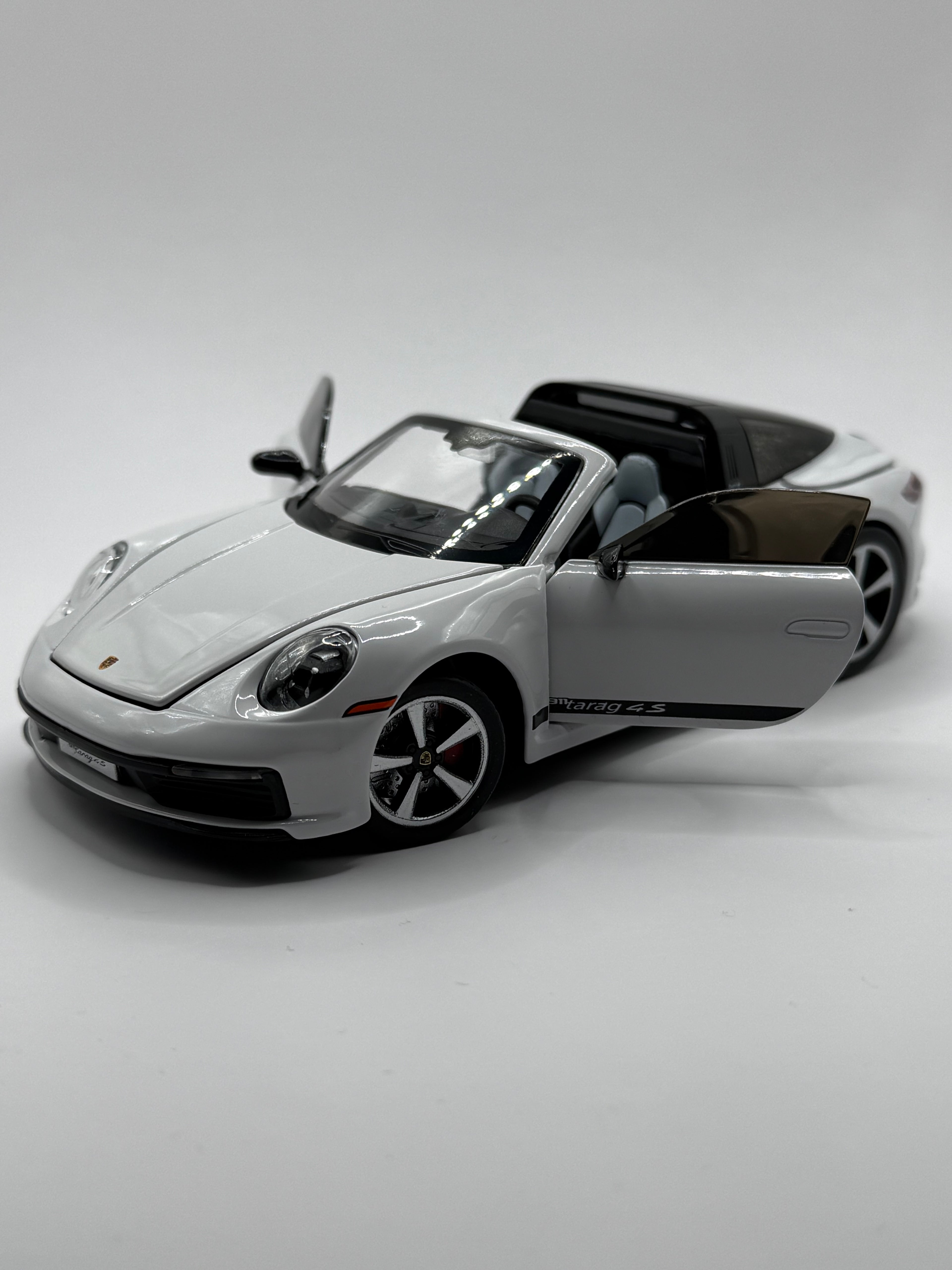 1:32 scale Porsche 911 Targa 4S diecast model car front view with doors open.
