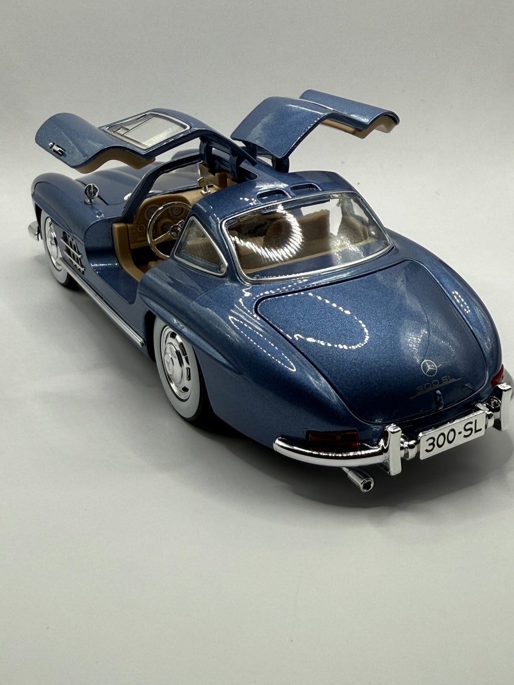 Detailed interior of 1/24 Mercedes 300 SL model car with functional opening Gullwing doors.