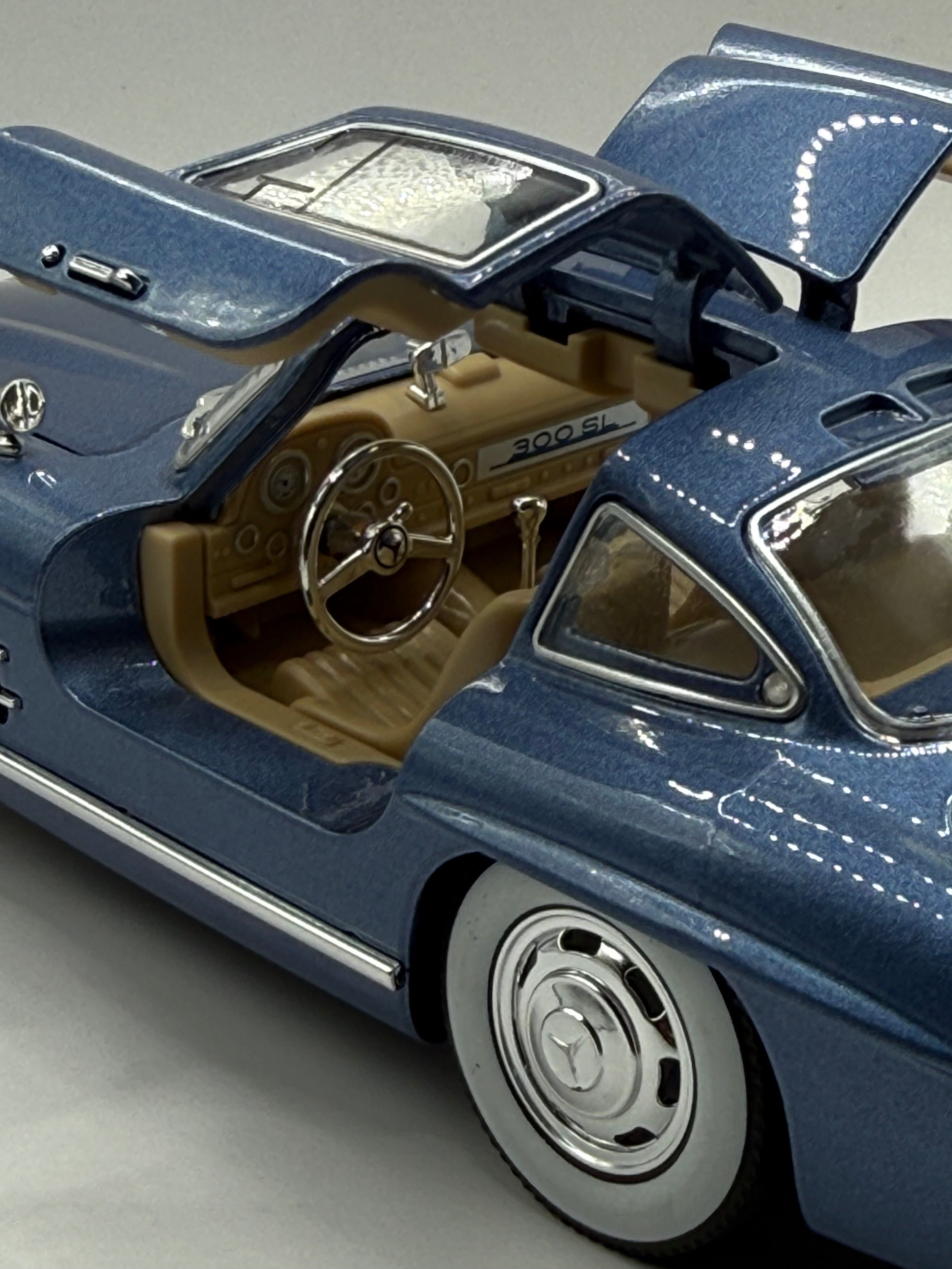 Detailed interior of 1/24 Mercedes 300 SL model car with functional opening Gullwing doors.