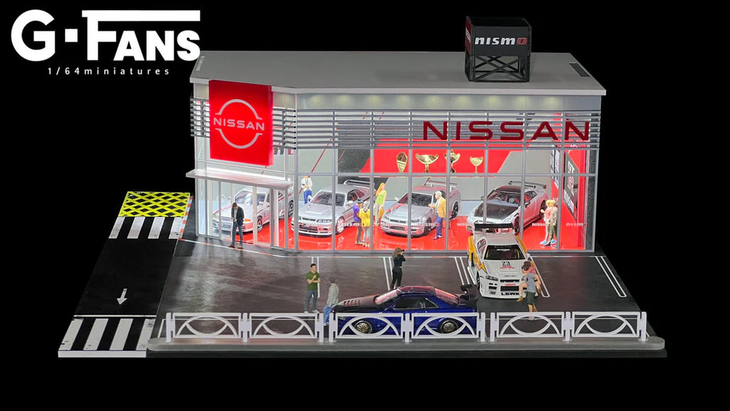 Front view of G-Fans 1:64 Nissan Nismo dealership diorama with LED lights on.