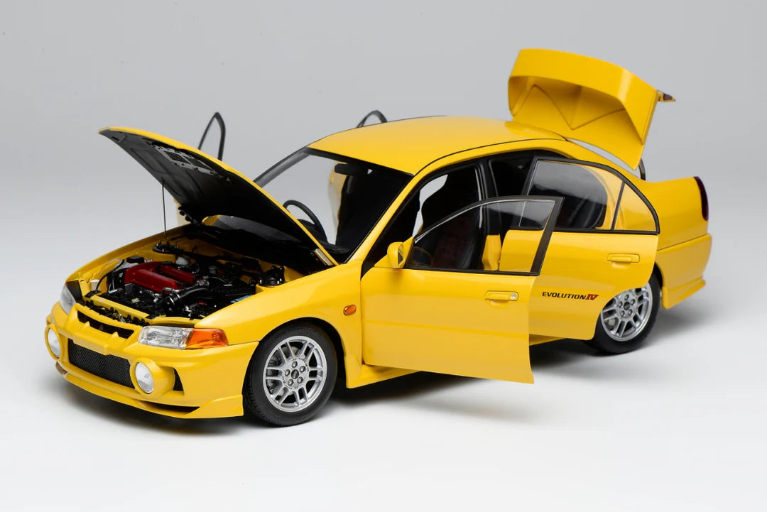 Motorhelix 1:18 Mitsubishi Lancer Evolution IV (1996) Dandelion Yellow
