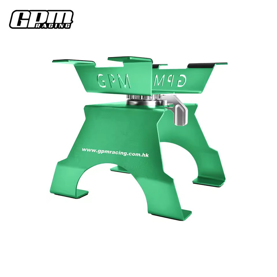 Green GPM Racing large scale aluminium RC car stand on workbench
