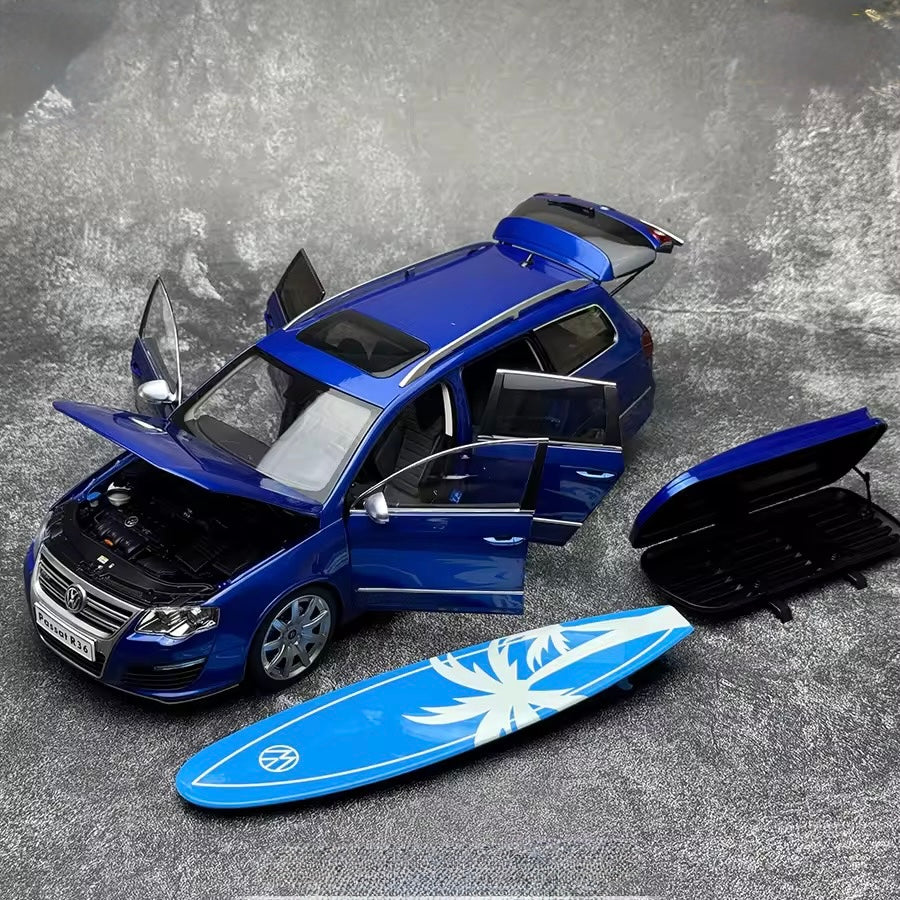 Volkswagen Passat R36 with all open doors and surf board